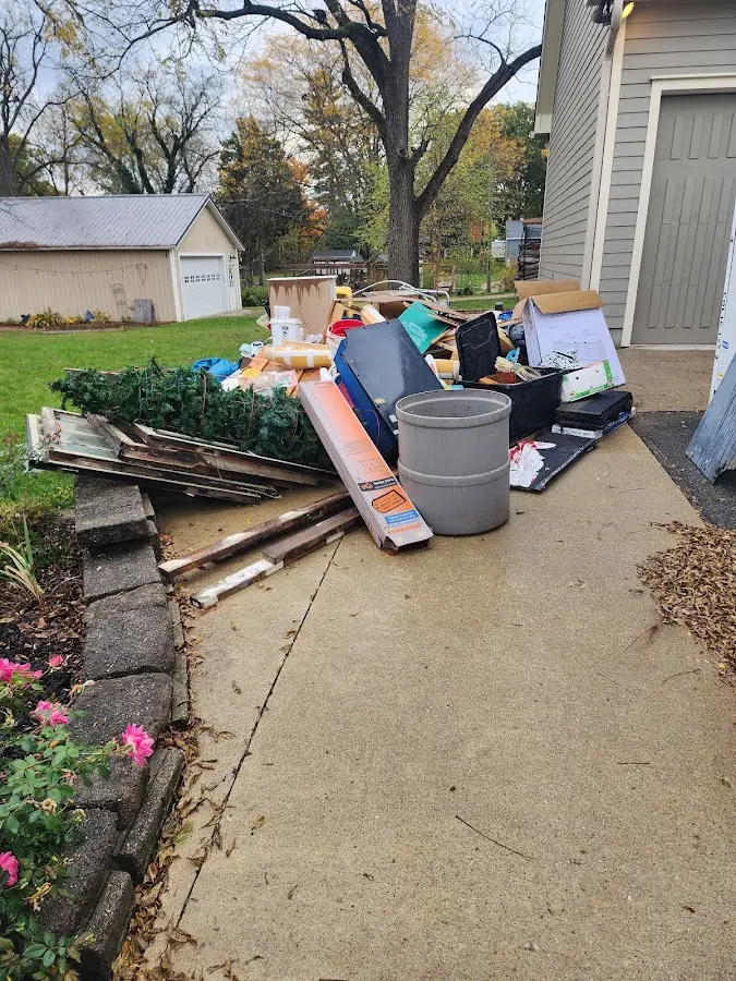 Dumpster being loaded with debris for 3 Yard Dumpster Rental in Dewey-Humboldt
